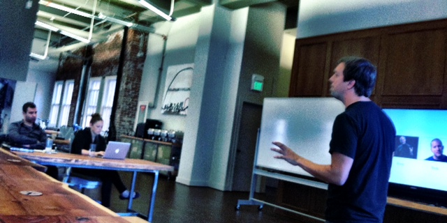 Tenrehte CEO Jennifer Indovina listens to Dave Merkoski